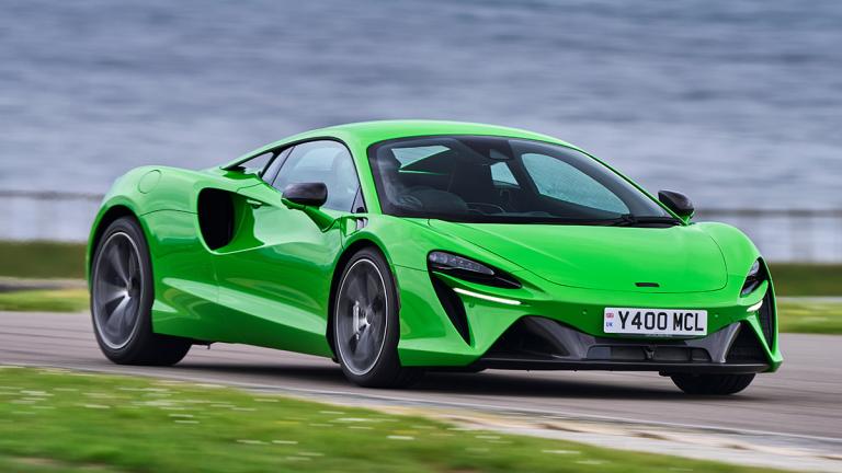 2025 McLaren Artura by a body of water.